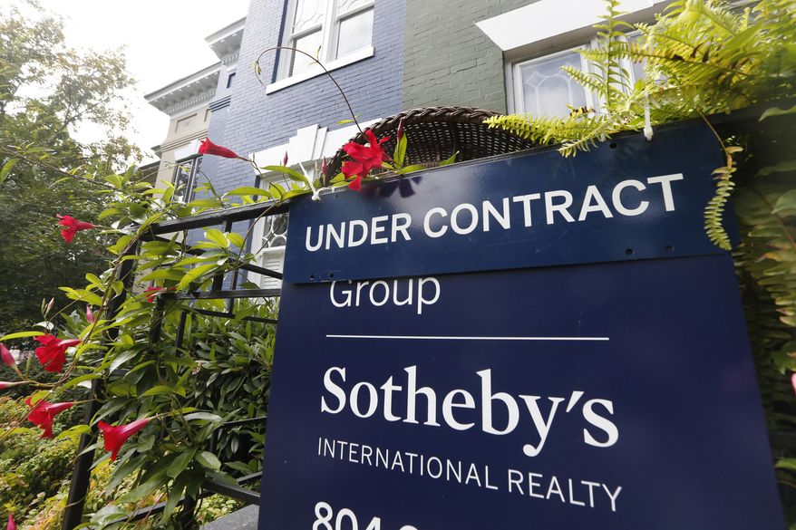 FILE - In this Aug. 16, 2019, file photo an under contract sign is posted outside a home Park Avenue in Richmond, Va. On Wednesday, Nov. 27, the National Association of Realtors releases its October report on pending home sales, which are seen as a barometer of future purchases. (AP Photo/Steve Helber, File)