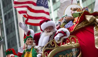 Santa Claus waves in front of Radio City Music Hall during the Macy&#39;s Thanksgiving Day Parade, Thursday, Nov. 28, 2019, in New York. (AP Photo/Eduardo Munoz Alvarez)