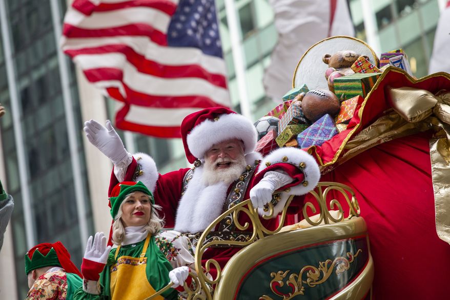 Santa Claus waves in front of Radio City Music Hall during the Macy's Thanksgiving Day Parade, Thursday, Nov. 28, 2019, in New York. (AP Photo/Eduardo Munoz Alvarez)