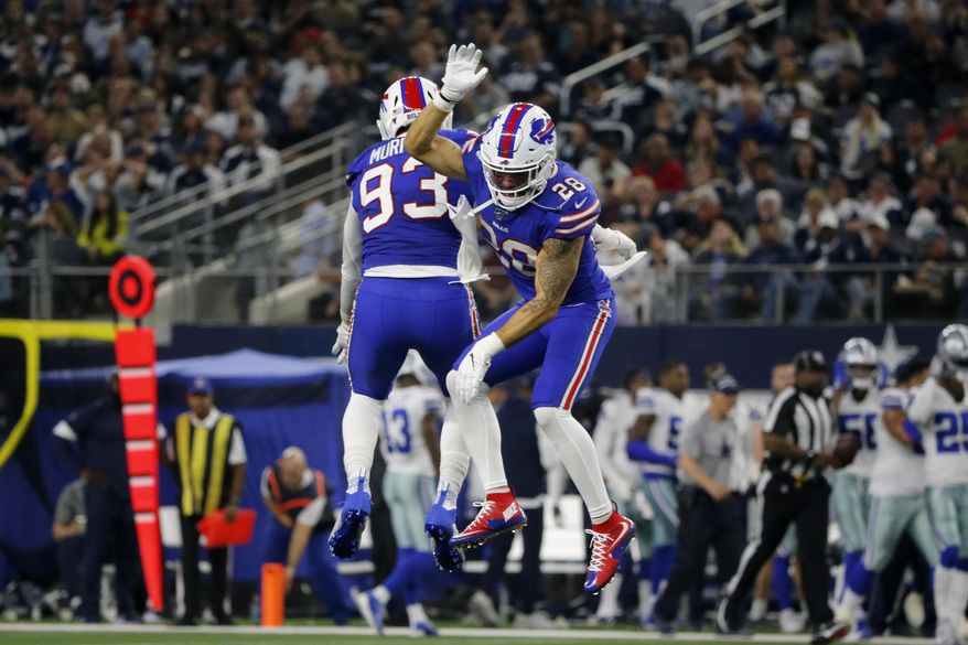 Buffalo Bills' Trent Murphy (93) and Kurt Coleman (28) celebrate a Dallas Cowboys quarterback Dak Prescott (4) fumble recovered by Murphy in the first half of an NFL football game in Arlington, Texas, Thursday, Nov. 28, 2019. (AP Photo/Michael Ainsworth)