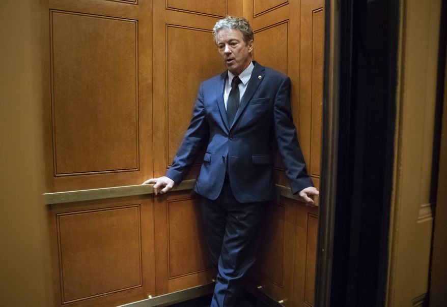 Sen. Rand Paul, R-Ky., waits inside an elevator after responding to reporters at the Capitol about his threat to reveal the name of the Ukraine whistleblower who helped initiate the impeachment inquiry against President Donald Trump by providing details ofTrump&#x27;s call with the Ukrainian president, in Washington, Wednesday, Nov. 6, 2019. (AP Photo/J. Scott Applewhite)