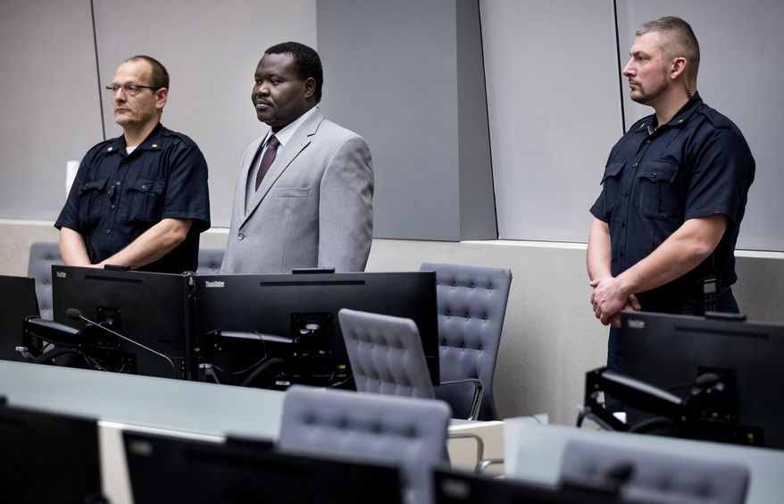FILE - In this Friday, Jan. 25, 2019 file photo, chief of Central African Republic's soccer federation Patrice-Edouard Ngaissona stands during his initial appearance before the judges of the International Criminal Court (ICC) in The Hague, the Netherlands. FIFA has banned a leading African soccer official who faces trial for war crimes in The Hague. FIFA says its ethics judges on Thursday, Nov. 28 banned Ngaissona for six years and eight months on charges including “discrimination and of failing to protect, respect or safeguard integrity and human dignity.” He was president of the Central African Republic’s soccer body for more than a decade since 2008. (Koen Van Well/Pool photo via AP, file)