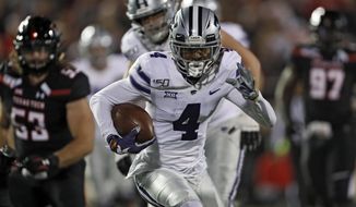 Kansas State&#39;s Malik Knowles (4) runs with the ball during the second half of the team&#39;s NCAA college football game against Texas Tech, Saturday, Nov. 23, 2019, in Lubbock, Texas. (Brad Tollefson/Lubbock Avalanche-Journal via AP)