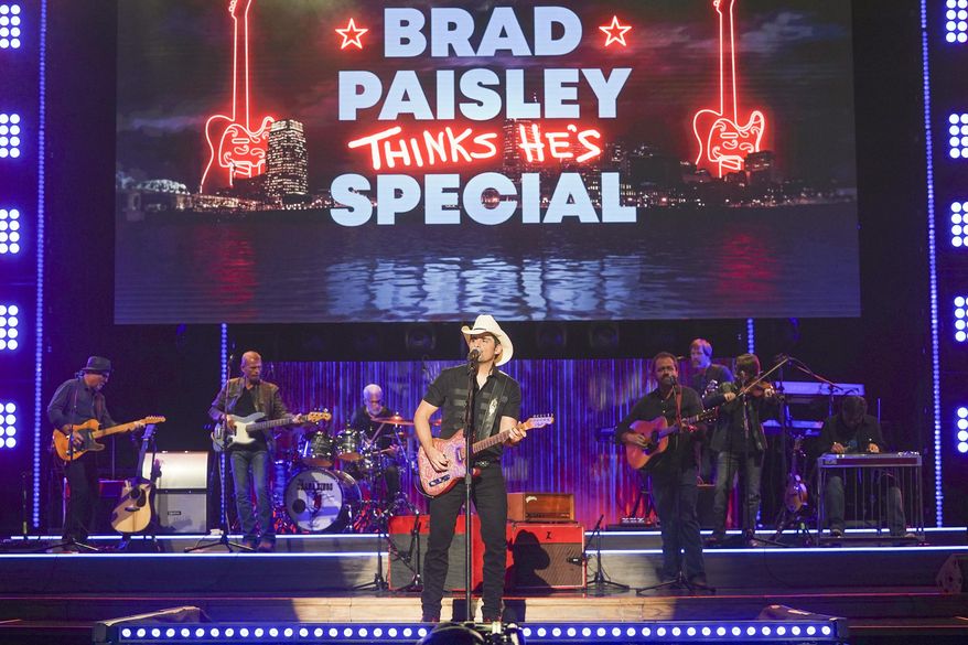 This image released by ABC shows Brad Paisley during a taping of his variety special "Brad Paisley Thinks He's Special," airing Dec. 3 at 8 p.m. EST on ABC. (Mark Levine/ABC via AP)