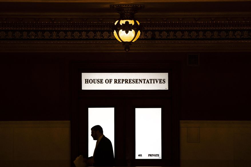 FILE - In this Nov. 20, 2019 file photo, Rep. Mark Rozzi, D-Berks, is silhouetted as he passes a window in the Pennsylvania Capitol in Harrisburg, Pa. When Pennsylvania overhauled its child sexual abuse laws this week, absent from the bill-signing ceremony were some survivors and victim advocates who feel conflicted by the compromise package. Rozzi predicted that a referendum will pass easily because voters who have read about sexual abuse scandals understand the need to deliver justice to victims. (AP Photo/Matt Rourke, File)