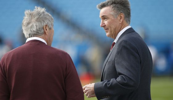 Washington Redskins general manager Bruce Allen, right, is seen prior to an NFL football game between the Carolina Panthers and the Washington Redskins in Charlotte, N.C., Sunday, Dec. 1, 2019. (AP Photo/Brian Blanco)