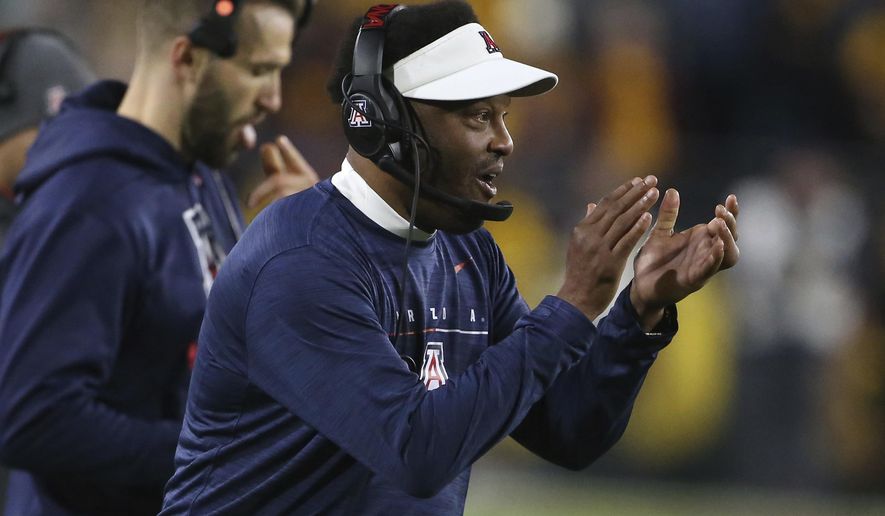 Arizona coach Kevin Sumlin claps in support of his team's defense against Arizona State during the first half of an NCAA college football game, Saturday, Nov. 30, 2019, in Tempe, Ariz. (AP Photo/Darryl Webb)