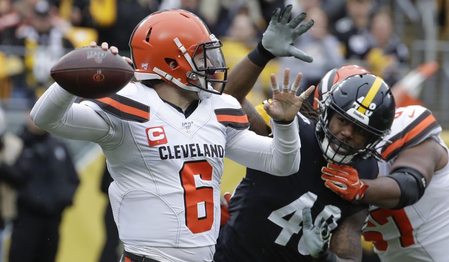 Cleveland Browns quarterback Baker Mayfield (6) passes as he is pressured by Pittsburgh Steelers outside linebacker Bud Dupree (48) in the first half of an NFL football game Sunday, Dec. 1, 2019, in Pittsburgh. (AP Photo/Gene J. Puskar)