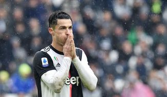 Juventus&#39; Cristiano Ronaldo reacts during the Italian Serie A soccer match between Juventus and Sassuolo at the Allianz Stadium in Turin, Italy, Sunday, Dec. 1, 2019. (Alessandro Di Marco/ANSA via AP)