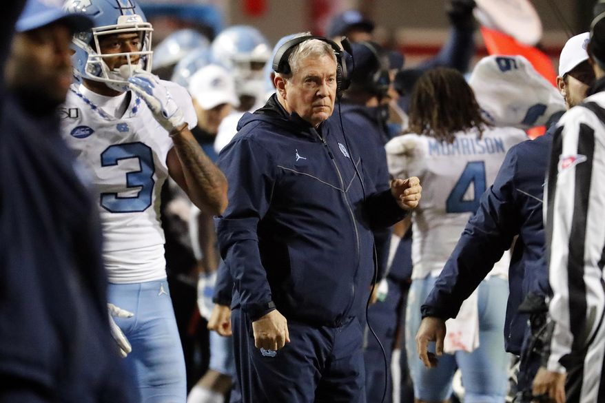 North Carolina head coach Mack Brown watches from the sideline during the second half of an NCAA college football game against North Carolina State in Raleigh, N.C., Saturday, Nov. 30, 2019. (AP Photo/Karl B DeBlaker)
