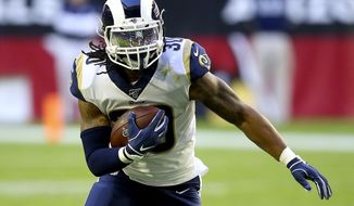 Los Angeles Rams running back Todd Gurley (30) runs against the Arizona Cardinals during the first half of an NFL football game, Sunday, Dec. 1, 2019, in Glendale, Ariz. (AP Photo/Ross D. Franklin)