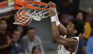 Minnesota center Daniel Orturu dunks against Clemson in the first half during an NCAA basketball game Monday, Dec. 2, 2019, in Minneapolis. (AP Photo/Andy Clayton-King)