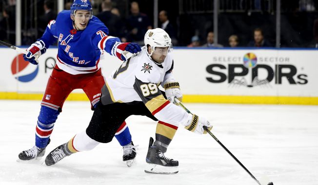New York Rangers defenseman Brady Skjei (76) cannot stop Vegas Golden Knights right wing Alex Tuch (89) from shooting on goal during the first period of an NHL hockey game, Monday, Dec. 2, 2019, in New York. (AP Photo/Kathy Willens)