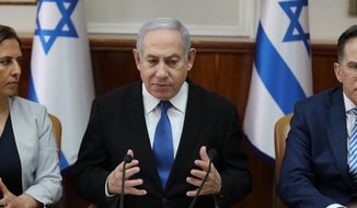 Israeli Prime Minister Benjamin Netanyahu attends the weekly cabinet meeting at his office in Jerusalem, Israel, Sunday, Dec. 1, 2019. (Abir Sultan/Pool Photo via AP)