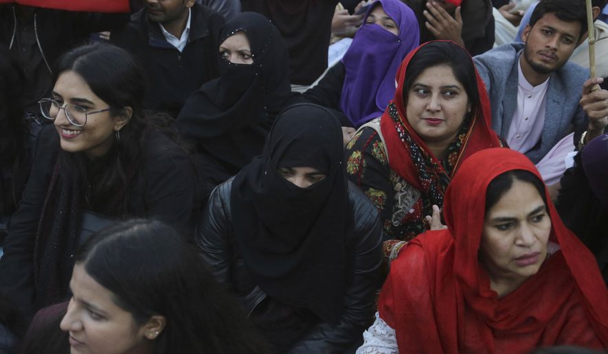 Pakistani students and civil society activists gather to rally against ban on students unions in Lahore, Pakistan, Friday, Nov. 29, 2019. Students backed by rights activists are holding rallies across the country in a rare show of strength to urge Prime Minister Imran Khan to lift a decades-long ban on peaceful political activities at education institutions. (AP Photo/K.M. Chaudary)