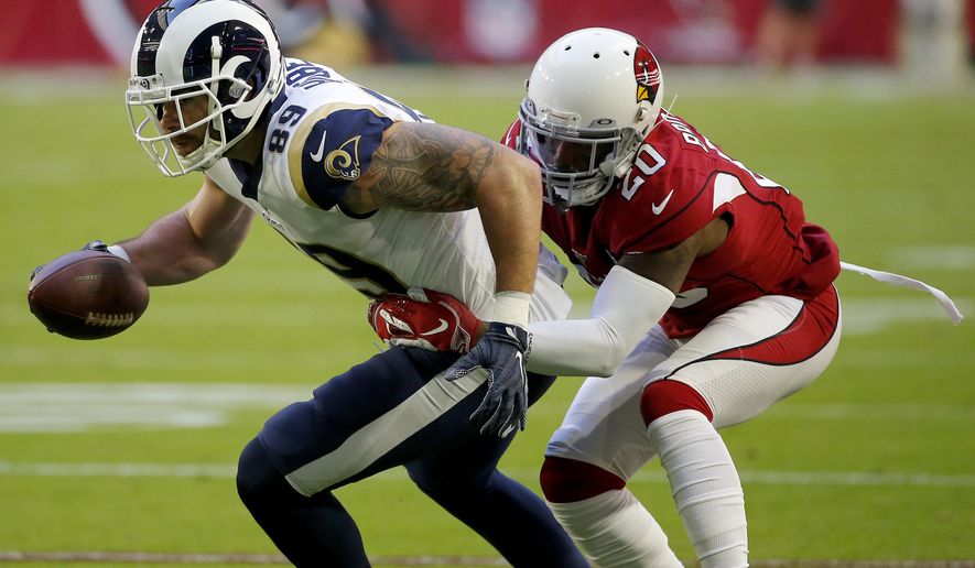 Arizona Cardinals defensive back Tramaine Brock (20) tackles Los Angeles Rams tight end Tyler Higbee (89) during the first half of an NFL football game, Sunday, Dec. 1, 2019, in Glendale, Ariz. (AP Photo/Rick Scuteri)