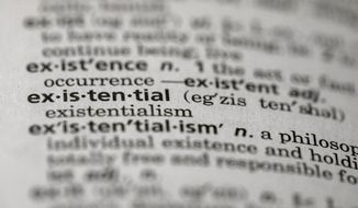 This Sunday, Dec. 1, 2019, photo shows the word &amp;quot;existential&amp;quot; in a dictionary in the Brooklyn borough of New York. Dictionary.com picked “existential” as the word of the year. The choice reflects months of high-stakes threats and crises, real and pondered, across the news, the world and throughout 2019. (AP Photo/Jenny Kane)