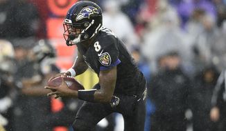 Baltimore Ravens quarterback Lamar Jackson runs the ball against the San Francisco 49ers in the first half of an NFL football game, Sunday, Dec. 1, 2019, in Baltimore, Md. (AP Photo/Gail Burton)