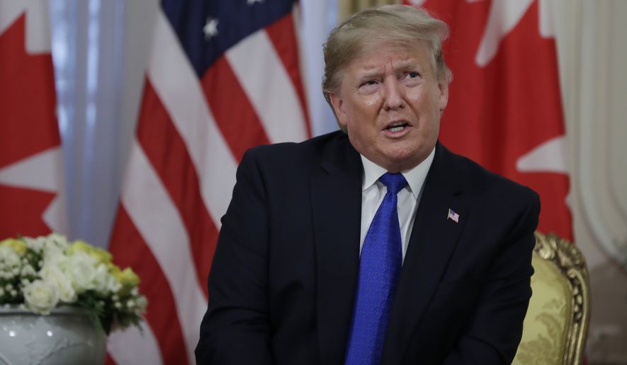 President Donald meets with Canadian Prime Minister Justin Trudeau at Winfield House, Tuesday, Dec. 3, 2019, in London. (AP Photo/ Evan Vucci)