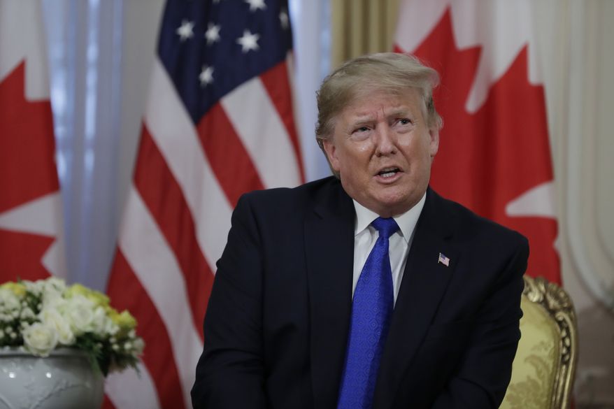President Donald meets with Canadian Prime Minister Justin Trudeau at Winfield House, Tuesday, Dec. 3, 2019, in London. (AP Photo/ Evan Vucci)