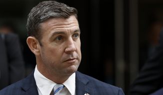 California Republican Rep. Duncan Hunter leaves federal court Tuesday, Dec. 3, 2019, in San Diego. Hunter gave up his yearlong fight against federal corruption charges and pleaded guilty Tuesday to misusing his campaign funds, paving the way for the six-term Republican to step down. (AP Photo/Gregory Bull) **FILE**