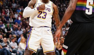 Los Angeles Lakers forward LeBron James reacts to a dunk against the Denver Nuggets during the first quarter an NBA basketball game Tuesday, Dec. 3, 2019, in Denver. (AP Photo/Jack Dempsey)