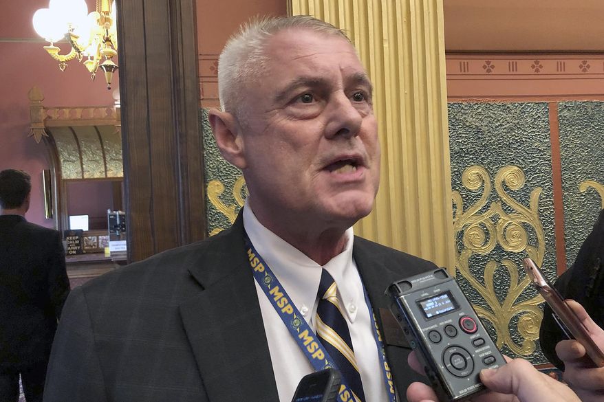 FILE - in this Sept. 3, 2019 file photo State Rep. Larry Inman, R-Williamsburg, speaks with reporters in the House chamber in Lansing, Mich. The trial of state Rep. Inman, from the Traverse City area who is facing federal charges in an alleged scheme to trade votes for campaign cash, will begin Tuesday, Dec. 3, 2019, in Grand Rapids, Mich. (AP Photo/David Eggert File)