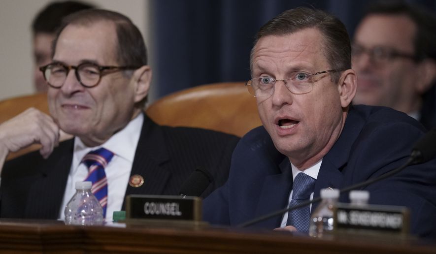 Rep. Doug Collins, R-Ga., the ranking member of the House Judiciary Committee, joined at left by Chairman Jerrold Nadler, D-N.Y., makes remarks during a hearing on the constitutional grounds for the impeachment of President Donald Trump, on Capitol Hill in Washington, Wednesday, Dec. 4, 2019. (AP Photo/J. Scott Applewhite)