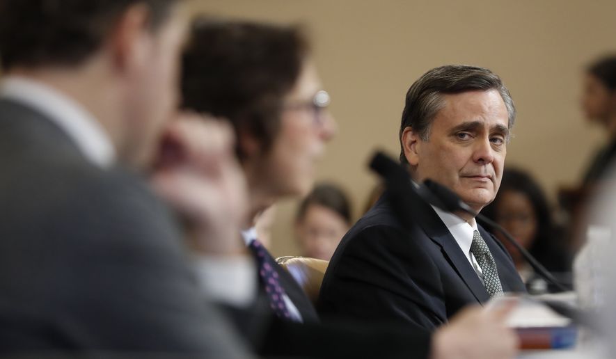 George Washington University Law School professor Jonathan Turley listens to Stanford Law School professor Pamela Karlan testify during a hearing before the House Judiciary Committee on the constitutional grounds for the impeachment of President Donald Trump, on Capitol Hill in Washington, Wednesday, Dec. 4, 2019. Harvard Law School professor Noah Feldman, is left. (AP Photo/Andrew Harnik)