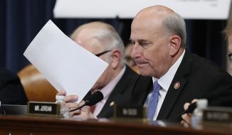 Rep. Louie Gohmert, R-Texas, enters a letter for the record during a hearing before the House Judiciary Committee on the constitutional grounds for the impeachment of President Donald Trump, Wednesday, Dec. 4, 2019, on Capitol Hill in Washington. (AP Photo/Jacquelyn Martin)