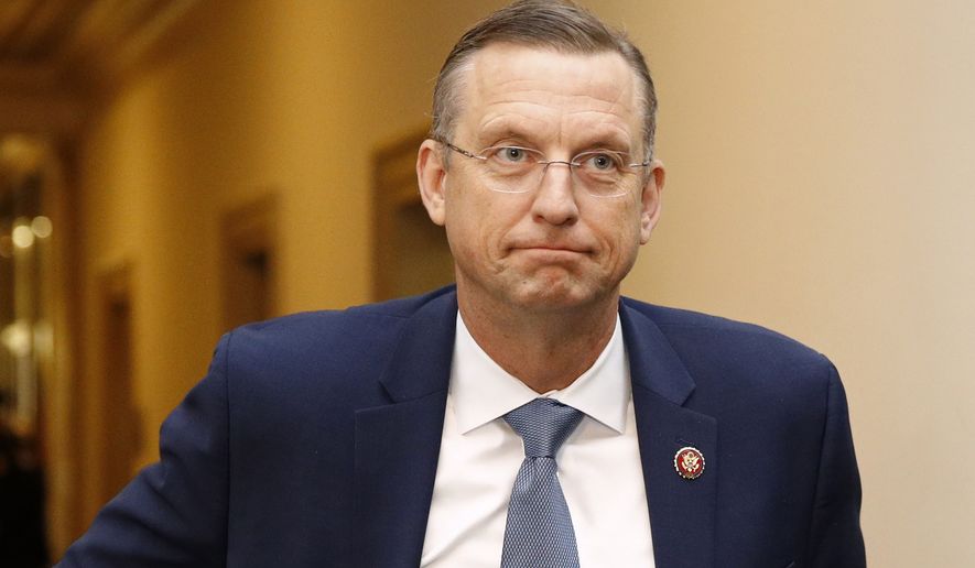 House Judiciary Committee ranking member Rep. Doug Collins, R-Ga., walks to the hearing room during a break in a hearing with Constitutional law experts before the House Judiciary Committee on the constitutional grounds for the impeachment of President Donald Trump. (AP Photo/Patrick Semansky)