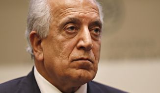 FILE - In this Feb. 8, 2019, file photo, Special Representative for Afghanistan Reconciliation Zalmay Khalilzad pauses while speaking about the prospects for peace, at the U.S. Institute of Peace, in Washington.  Afghanistan’s former deputy minister says Khalilzad is in the Afghan capital “to discuss the latest in peace efforts.”  Former deputy foreign minister Hekmat Karzai tweeted pictures of his meeting with Khalilzad Wednesday, Dec. 4, 2019,  saying ‘we spoke about the way forward.”   (AP Photo/Jacquelyn Martin, File)