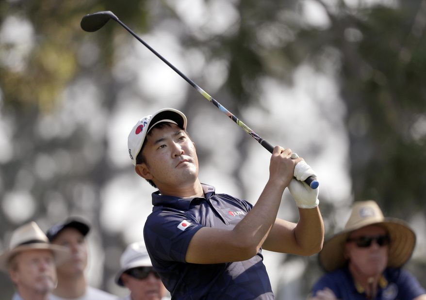 Takumi Kanaya of Japan tees off on the 17th hole during the opening round of the Australian Open Golf tournament in Sydney, Thursday, Dec. 5, 2019. (AP Photo/Rick Rycroft)