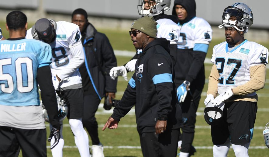 Carolina Panthers interim head coach Perry Fewell calls the team to huddle during NFL football practice at the team's training facility, Wednesday, Dec. 4, 2019, in Charlotte, N.C. (David T. Foster III/The Charlotte Observer via AP)