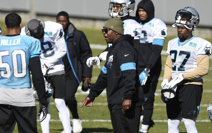 Carolina Panthers interim head coach Perry Fewell calls the team to huddle during NFL football practice at the team's training facility, Wednesday, Dec. 4, 2019, in Charlotte, N.C. (David T. Foster III/The Charlotte Observer via AP)