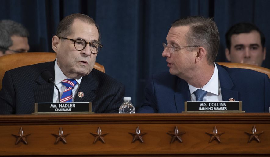 House Judiciary Committee Chairman Rep. Jerrold Nadler, D-N.Y., left, talks with ranking member Rep. Doug Collins, R-Ga., during a hearing before the House Judiciary Committee on the constitutional grounds for the impeachment of President Donald Trump, on Capitol Hill in Washington, Wednesday, Dec. 4, 2019. (Saul Loeb/Pool photo via AP)