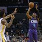 Charlotte Hornets guard Devonte&#39; Graham (4) shoots over Golden State Warriors forward Marquese Chriss during the first half of an NBA basketball game in Charlotte, N.C., Wednesday, Dec. 4, 2019. (AP Photo/Nell Redmond)
