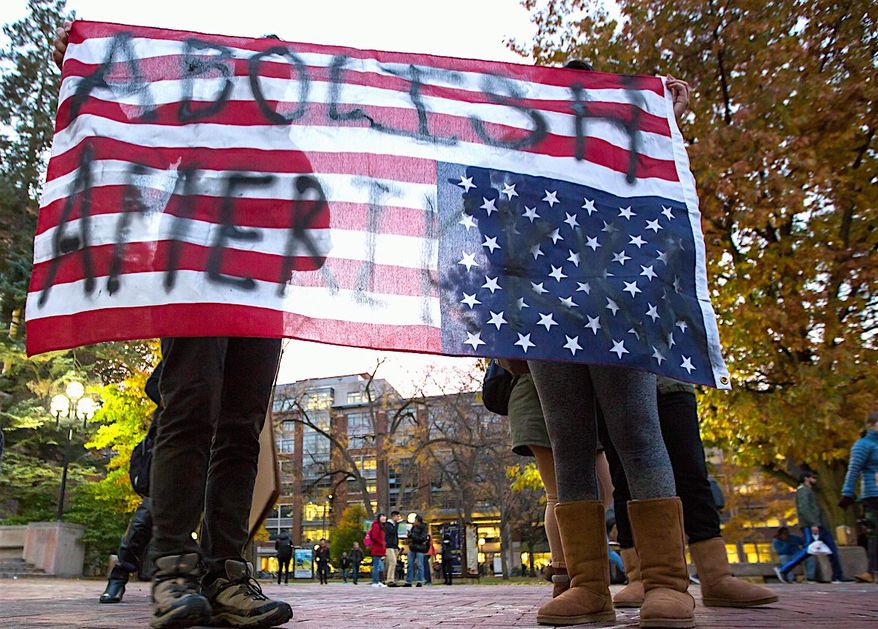 One veteran pollster now calls for the nation to balance out differences with one another to ensure society will "thrive and survive." (Associated Press)
