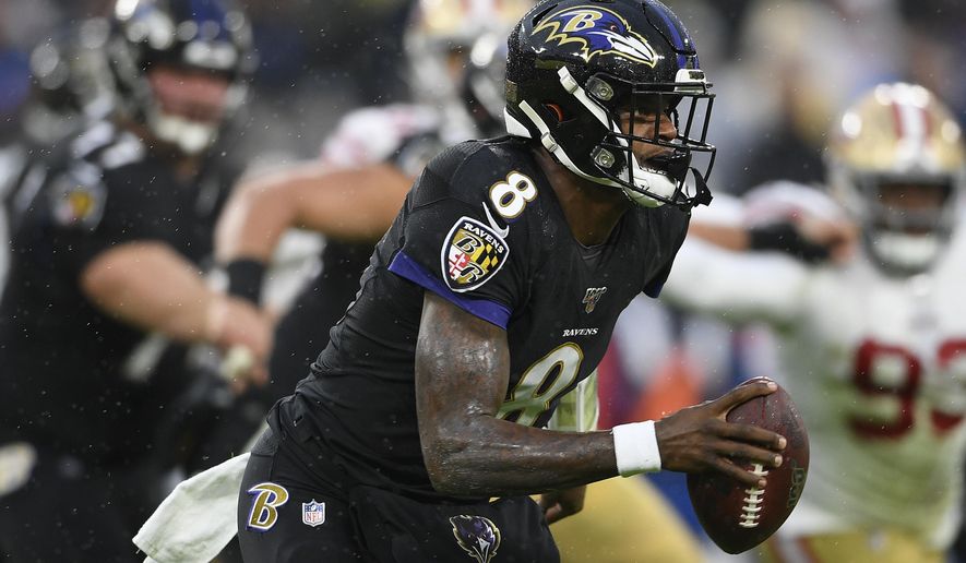 Baltimore Ravens quarterback Lamar Jackson (8) looks to pass the ball in the first half of an NFL football game against the San Francisco 49ers, Sunday, Dec. 1, 2019, in Baltimore, Md. (AP Photo/Nick Wass)