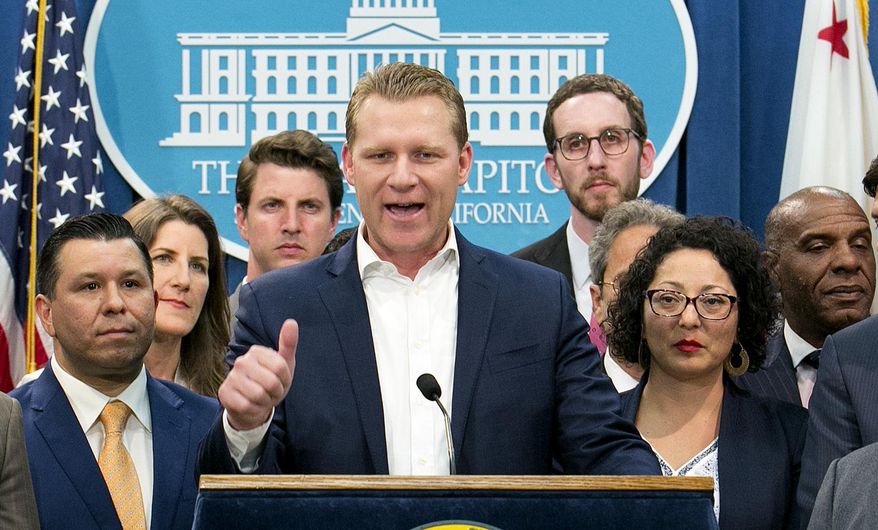 FILE - In this Monday, July 17, 2017 file photo, Assembly Republican Leader Chad Mayes, R-Yucca Valley, center, discusses the cap-and-trade bill at the Capitol in Sacramento, Calif. The super-minority in the Legislature has lost another state lawmaker, as former Assembly Republican leader Chad Mayes of Yucca Valley has decided to run for re-election in 2020 with no party preference.(AP Photo/Rich Pedroncelli, File)