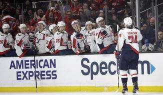 Washington Capitals&#39; John Carlson (74) celebrates his goal with teammates on the bench during the first period of an NHL hockey game against the Los Angeles Kings Wednesday, Dec. 4, 2019, in Los Angeles. (AP Photo/Marcio Jose Sanchez) ** FILE **
