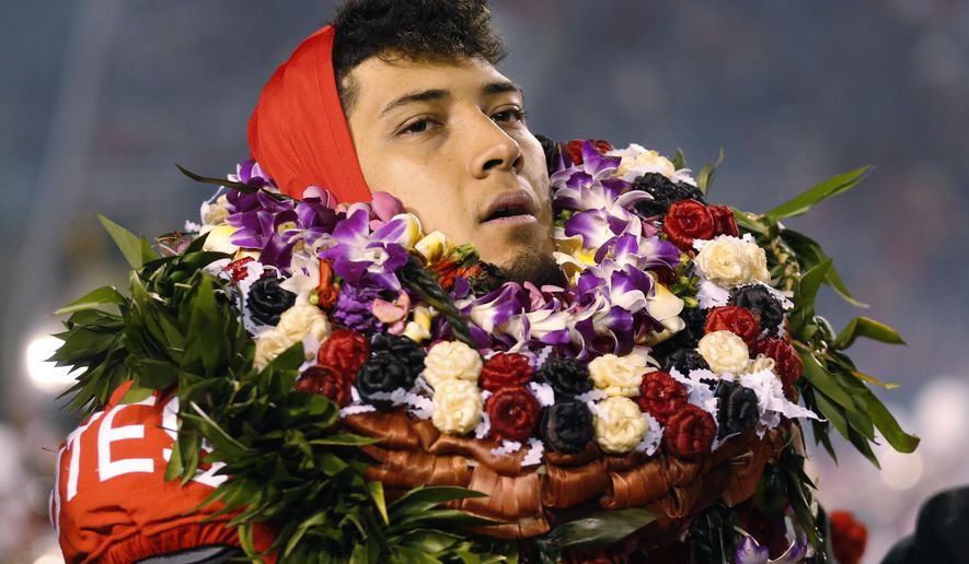 Utah defensive end Bradlee Anae walks on the field before the team's NCAA college football game against Colorado on Saturday, Nov. 30, 2019, in Salt Lake City. (AP Photo/Rick Bowmer)