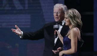 Team owner Joe Gibbs, left, speaks after being given the Bill France Award of Excellence at the NASCAR Cup Series Awards on Thursday, Dec. 5, 2019, in Nashville, Tenn. (AP Photo/Mark Humphrey)