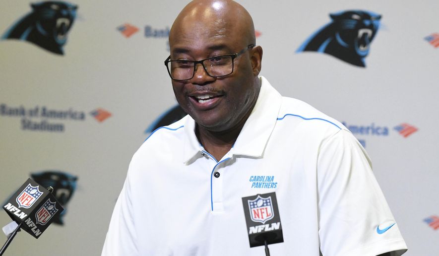 Carolina Panthers' Perry Fewell laughs as he answers a question during his first press conference as the NFL football team's interim head coach, at Bank of America Stadium in Charlotte, N.C., Wednesday, Dec. 4, 2019. Ron Rivera was fired as head coach on Tuesday. (David T. Foster III/The Charlotte Observer via AP)