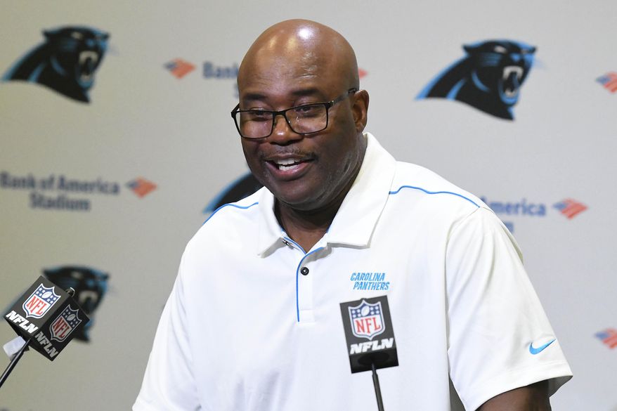 Carolina Panthers' Perry Fewell laughs as he answers a question during his first press conference as the NFL football team's interim head coach, at Bank of America Stadium in Charlotte, N.C., Wednesday, Dec. 4, 2019. Ron Rivera was fired as head coach on Tuesday. (David T. Foster III/The Charlotte Observer via AP)