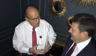 In this handout photo provided by Adriii Derkach&#x27;s press office, Rudy Giuliani, an attorney for U.S President Donald Trump, left, meets with Ukrainian lawmaker Adriii Derkach in Kyiv, Ukraine, Thursday, Dec. 5, 2019. A Ukrainian lawmaker says he has met up with Rudy Giuliani, President Donald Trump’s personal attorney, in Kyiv to discuss an anti-corruption project. Derkach, who has previously accused the son of former Vice President Joe Biden of embezzling money from a gas company in Ukraine, posted photos of Thursday’s meeting on his Facebook page. (Adriii Derkach&#x27;s press office via AP)