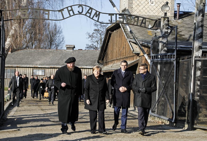 Museum director Piotr Cywinski, German Chancellor Angela Merkel, Polish Prime Minister Mateusz Morawiecki and deputy director Andrzej Kacorzyk, from left, visit the former Nazi death camp of Auschwitz-Birkenau in Oswiecim, Poland on Friday, Friday, Dec. 6, 2019. Merkel attend an event in occasion of the 10th anniversary of the founding of the Auschwitz Foundation. (Photo/Markus Schreiber)