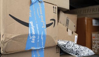 In this July 17, 2018, file photo Amazon Prime packages sit in a delivery truck before being unloaded in Miami. (AP Photo/Lynne Sladky, File)