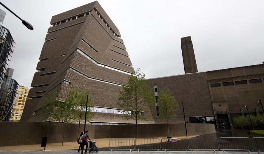 FILE - In this Tuesday, June 14, 2016 file photo, an exterior view shows a new building called the Switch House, at left, which has been added on to the Tate Modern gallery in London. A British teenager pleaded guilty Friday, Dec. 6, 2019 to attempted murder for throwing a 6-year-old French boy from the 10th-floor viewing platform at London's Tate Modern art gallery.(AP Photo/Matt Dunham)