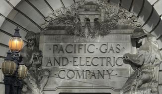 FILE - In this Oct. 10, 2019, file photo, a Pacific Gas &amp;amp; Electric sign is shown outside of a PG&amp;amp;E building in San Francisco. Pacific Gas and Electric says it has reached a $13.5 billion settlement that will resolve all major claims related to devastating wildfires blamed on its outdated equipment and negligence. The settlement, which the utility says was reached Friday, Dec. 6, 2019, still requires court approval. (AP Photo/Jeff Chiu)